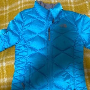 This is a true treasure . It’s a pretty turquoise like new puffer coat size 12